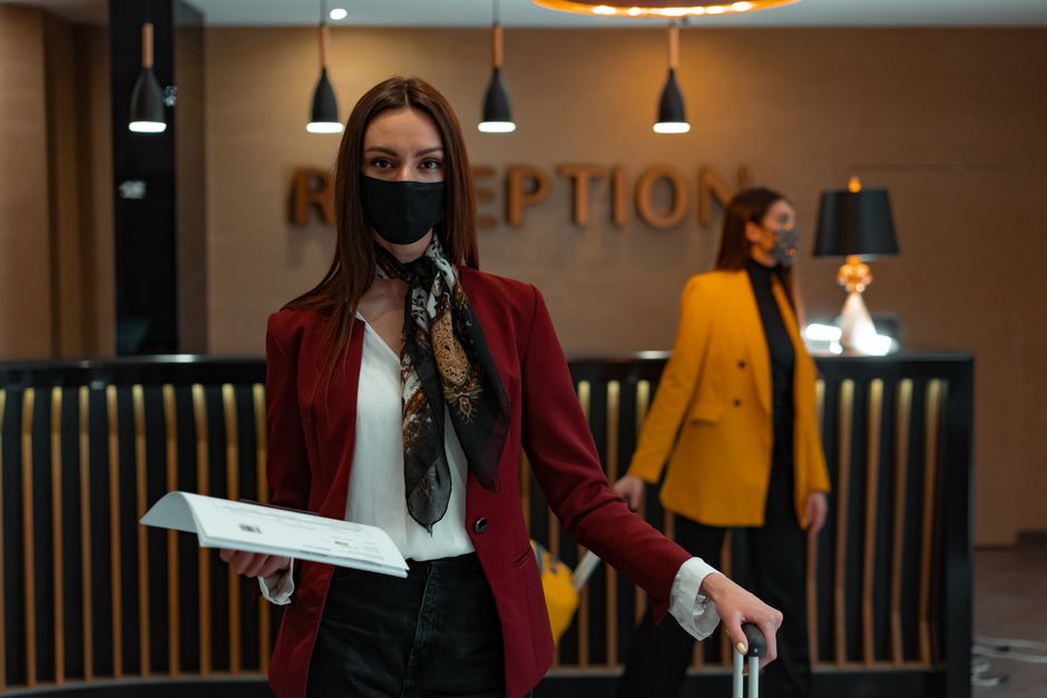Hotel security officer greeting a guest in a Surrey hotel lobby in the evening