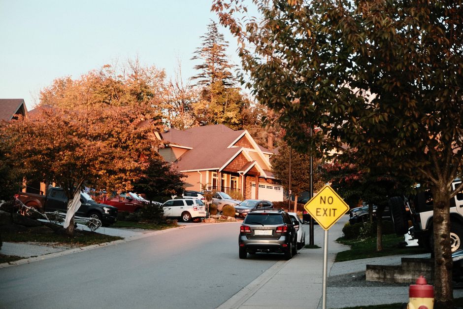 Residential security guard walking a townhouse complex in Surrey BC at dusk